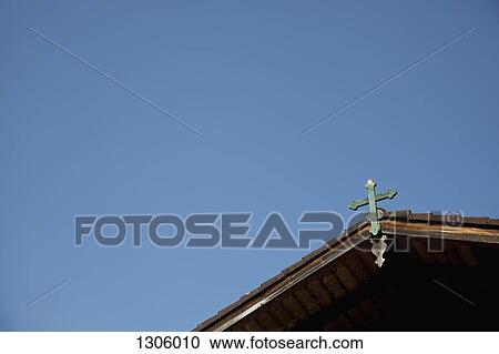 Stock Image - View of church against blue sky. Fotosearch