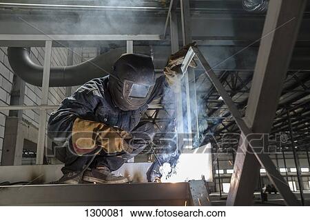 Welder working in metal industry View Large Photo Image Stock Image - Welder working in metal industry. Fotosearch