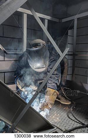 Welder working in metal industry View Large Photo Image Stock Photo - Welder working in metal industry. Fotosearch