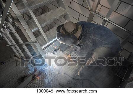 Welder working in metal industry View Large Photo Image Stock Photography - Welder working in metal industry. Fotosearch