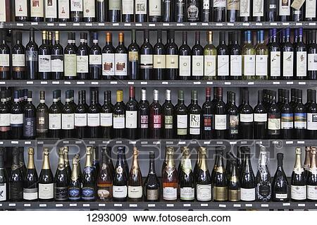 Wine bottles in wine shop View Large Photo Image Stock Photo - Wine bottles in wine shop. Fotosearch