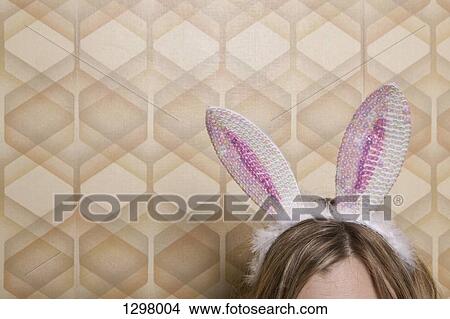 Woman with rabbit ears, high section View Large Photo Image Picture - Woman with rabbit ears, high section. Fotosearch