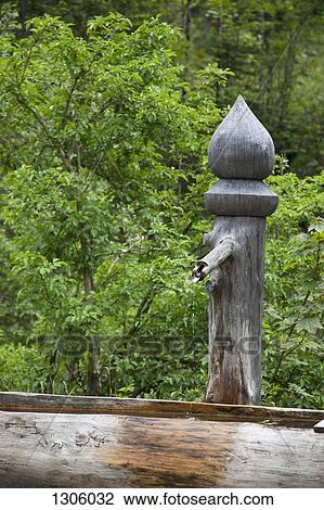 Stock Image - Wood water pump in forest. Fotosearch
