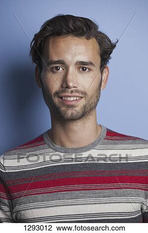 Young adult man looking at camera, close-up View Large Photo Image Stock Image - Young adult man looking at camera, close-up. Fotosearch