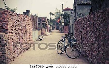 "Bicycle parked narrow street in Hanoi, Vietnam" View Large Photo Image Stock Photo - "Bicycle parked narrow street in Hanoi, Vietnam". Fotosearch