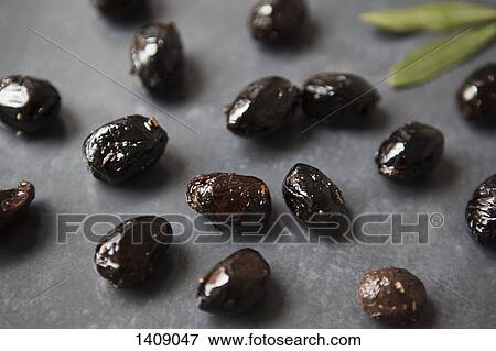 Black olives on table View Large Photo Image Stock Photo - Black olives on table. Fotosearch