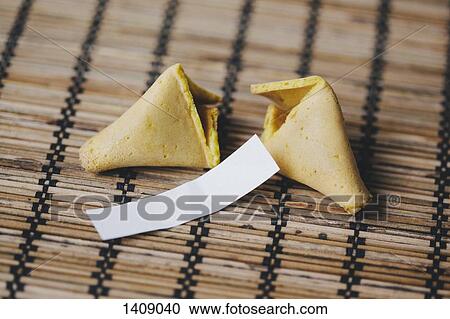 Broken fortune cookie on bamboo mat View Large Photo Image Stock Image - Broken fortune cookie on bamboo mat. Fotosearch