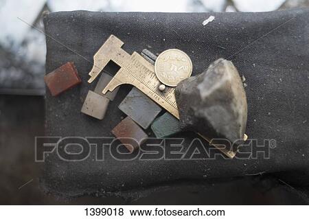 Caliper with stones on cloth View Large Photo Image Stock Photo - Caliper with stones on cloth. Fotosearch
