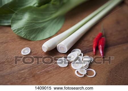 Chopped leek with red chili peppers on wooden table View Large Photo Image Stock Photography - Chopped leek with red chili peppers on wooden table. Fotosearch