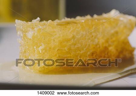 Close-up of honeycomb in plate View Large Photo Image Stock Image - Close-up of honeycomb in plate. Fotosearch