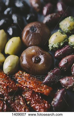 Close-up of various olives with onions and sun dried tomatoes View Large Photo Image Stock Photo - Close-up of various olives with onions and sun dried tomatoes. Fotosearch