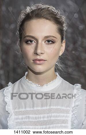 Stock Image - Close-up portrait of beautiful young woman. Fotosearch