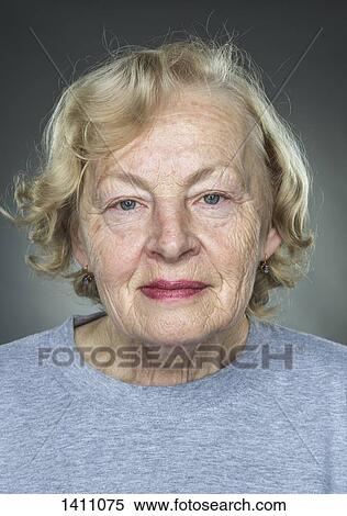 Close-up portrait of senior woman against gray background View Large Photo Image Stock Photography - Close-up portrait of senior woman against gray background. Fotosearch