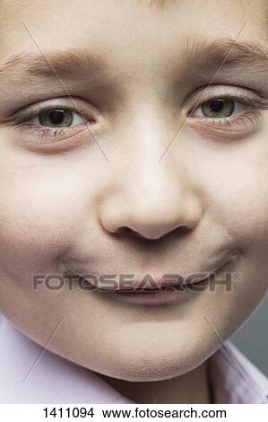 Picture - Close-up portrait of smiling boy. Fotosearch