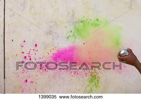 Cropped image of hand throwing powder paints on wall during Holi View Large Photo Image Stock Photography - Cropped image of hand throwing powder paints on wall during Holi. Fotosearch