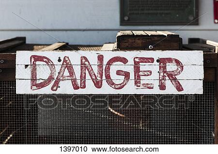 Stock Image - Danger sign on metal box. Fotosearch