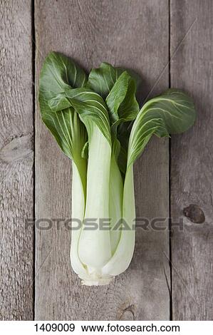 Directly above of bok choy on wooden table View Large Photo Image Stock Photo - Directly above of bok choy on wooden table. Fotosearch