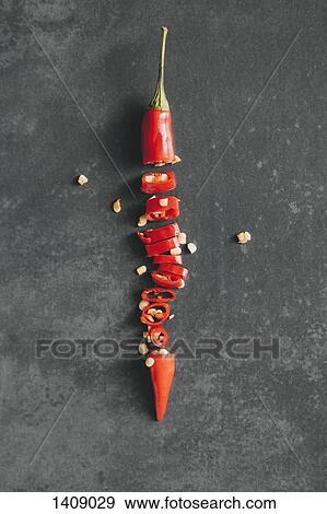 Directly above shot of chopped red chili pepper on table View Large Photo Image Stock Photo - Directly above shot of chopped red chili pepper on table. Fotosearch