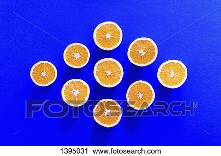 Directly above shot of orange slices arranged in diamond shape on blue background View Large Photo Image Stock Image - Directly above shot of orange slices arranged in diamond shape on blue background. Fotosearch