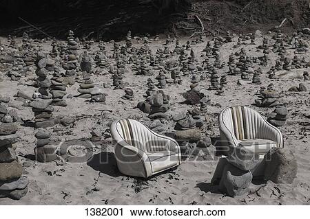 Empty armchairs and stack stones View Large Photo Image Stock Image - Empty armchairs and stack stones. Fotosearch