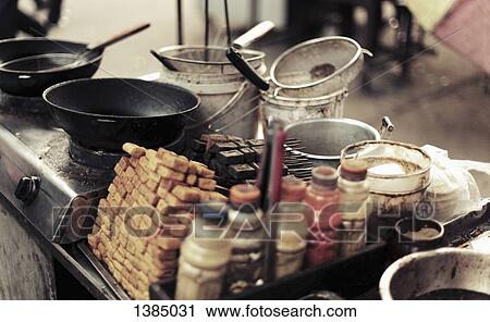 Stock Image - "Food stall at street market, China". Fotosearch