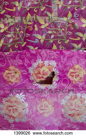 Stock Photograph - Full frame shot of floral patterned pink fabric. Fotosearch