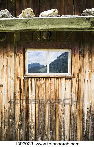 Full frame shot of log cabin with reflection of mountains on window View Large Photo Image Stock Image - Full frame shot of log cabin with reflection of mountains on window. Fotosearch