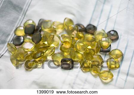 Green gemstones on bed View Large Photo Image Stock Photo - Green gemstones on bed. Fotosearch