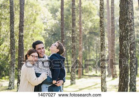 Happy family in forest View Large Photo Image Stock Photo - Happy family in forest. Fotosearch