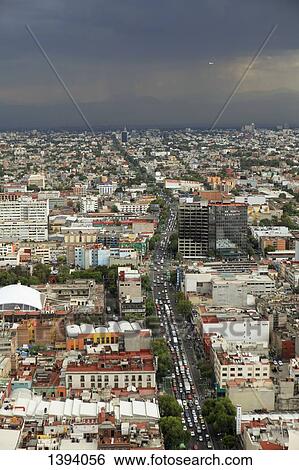 High angle view of cityscape against cloudy sky View Large Photo Image Stock Photograph - High angle view of cityscape against cloudy sky. Fotosearch