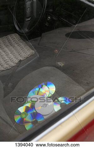 High angle view of compact discs on car seat View Large Photo Image Stock Image - High angle view of compact discs on car seat. Fotosearch