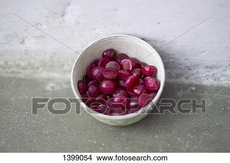 Picture - High angle view of gemstones in bowl on surface. Fotosearch