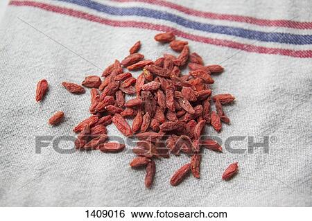 Stock Photograph - High angle view of goji berries on cloth. Fotosearch