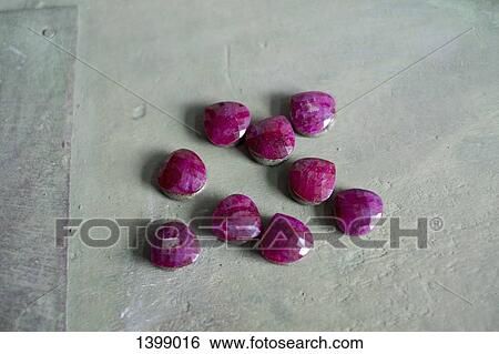 High angle view of pink gemstones on textured surface View Large Photo Image Stock Photograph - High angle view of pink gemstones on textured surface. Fotosearch