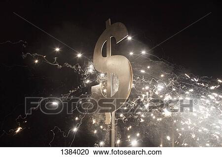 Illuminated dollar symbol with fireworks at night View Large Photo Image Stock Image - Illuminated dollar symbol with fireworks at night. Fotosearch