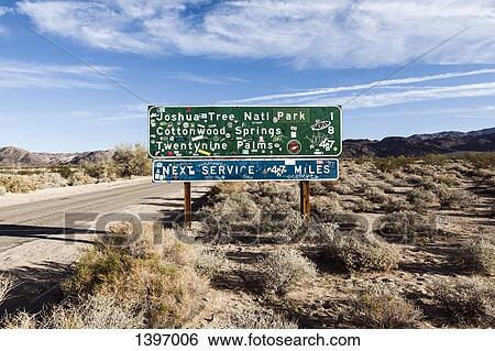 Information sign by road at Joshua Tree National Park against sky View Large Photo Image Stock Photograph - Information sign by road at Joshua Tree National Park against sky. Fotosearch