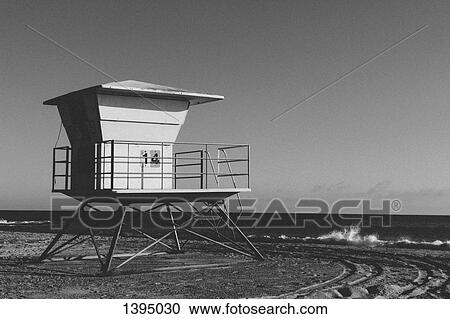 Stock Image - Lifeguard hut on beach against clear sky. Fotosearch