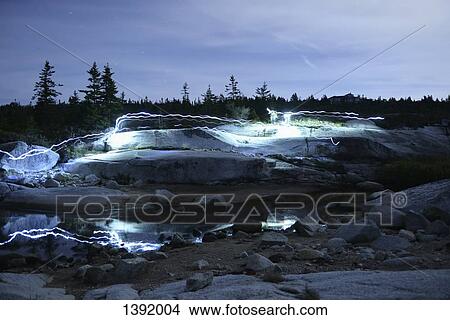 Light trails on rocky landscape View Large Photo Image Picture - Light trails on rocky landscape. Fotosearch