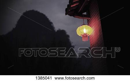 "Low angle view of Chinese lantern hanging on house roof at night, Huanggyao, China" View Large Photo Image Stock Image - "Low angle view of Chinese lantern hanging on house roof at night, Huanggyao, China". Fotosearch
