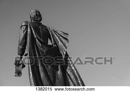 Stock Photography - Low angle view of Christopher Columbus statue against clear sky. Fotosearch