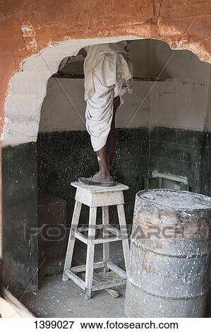 Low section of house painter standing on table View Large Photo Image Stock Photo - Low section of house painter standing on table. Fotosearch
