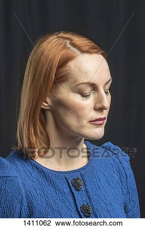 Mature woman with eyes closed against black background View Large Photo Image Stock Image - Mature woman with eyes closed against black background. Fotosearch