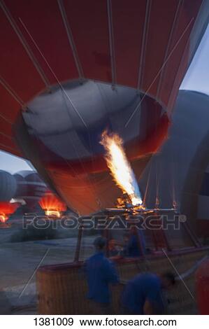 Men inflating hot-air balloon View Large Photo Image Stock Photo - Men inflating hot-air balloon. Fotosearch