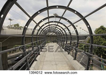 Metallic arches on bridge against sky View Large Photo Image Stock Image - Metallic arches on bridge against sky. Fotosearch