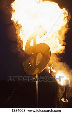 Metallic dollar sign set on fire at night View Large Photo Image Stock Image - Metallic dollar sign set on fire at night. Fotosearch