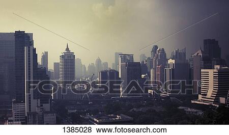Stock Photo - "Modern buildings at Bangkok against sky, Thailand". Fotosearch