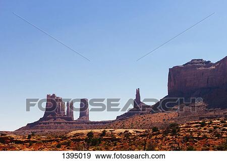 Monument Valley against clear blue sky View Large Photo Image Stock Photo - Monument Valley against clear blue sky. Fotosearch
