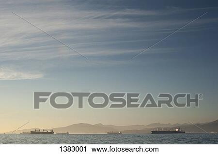 Stock Image - Nautical vessels sailing in sea against sky. Fotosearch