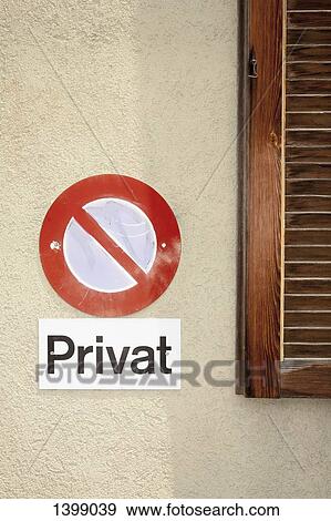 Stock Photo - No parking sign with text on wall. Fotosearch