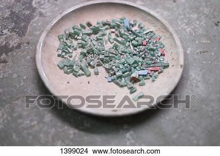 Pieces of mineral stone in plate View Large Photo Image Picture - Pieces of mineral stone in plate. Fotosearch